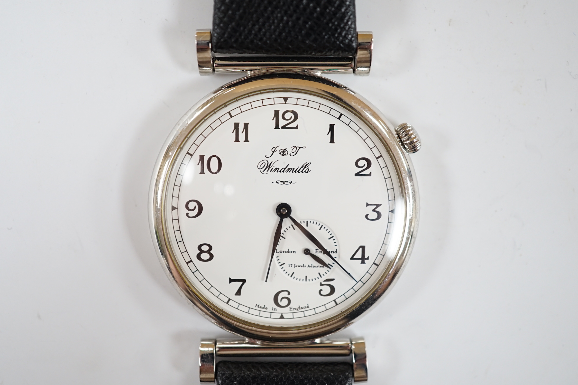 A gentleman's 2006 Joseph & Thomas Windmills Bartholomew First Edition white metal (stamped 950 for platinum) manual wind wrist watch, numbered 00144/00150, on leather strap with stainless steel deployment clasp, with or